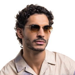 Shop Ray-Ban Hexagonal Unisex Sunglasses in Shiny Gold online.