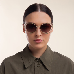 Shop MIU MIU Cat Eye Sunglasses in Pale Gold online.