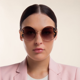 Shop MIU MIU Round Sunglasses in Rose Gold online.