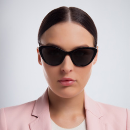 Shop MIU MIU Cat Eye Sunglasses in Black online.