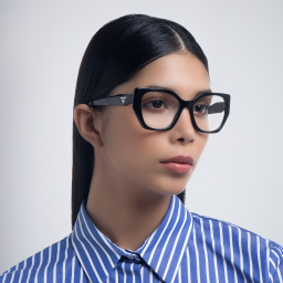 Shop PRADA Irregular Eyeglasses in Matte Black online.