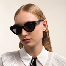 Shop GUCCI Cat Eye Sunglasses in Black online.