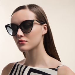 Shop GUCCI Cat Eye Sunglasses in Black online.