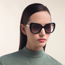Shop PRADA Cat Eye Sunglasses in Black online.