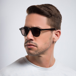 Shop SAINT LAURENT Round Sunglasses in Black online.