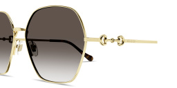 Shop GUCCI Horsebit Oversized Irregular Sunglasses in Gold online.