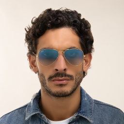 Shop Ray-Ban Unisex Pilot Sunglasses in Metal in Gold online.