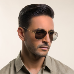 Shop Ray-Ban Unisex Pilot Sunglasses in Gold online.