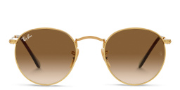 Shop Ray-Ban Round Metal Sunglasses in Gold online.