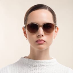 Shop Ray-Ban Unisex Round Sunglasses in Beige online.