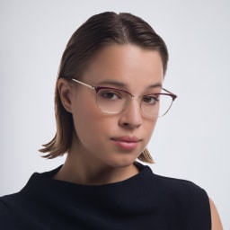 Shop PRADA Cat Eye Eyeglasses in Red online.