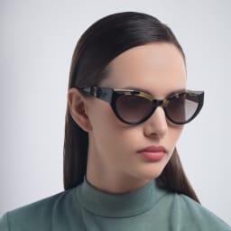 Shop PRADA Cat Eye Sunglasses in Black online.