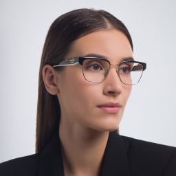 Shop PRADA Irregular Eyeglasses in Black/Pale Gold online.