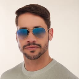 Shop Ray-Ban Aviator Gradient Sunglasses in Gold online.