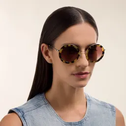 Shop MIU MIU Oversized Round Sunglasses in Light Havana online.