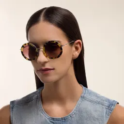 Shop MIU MIU Oversized Round Sunglasses in Light Havana online.