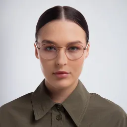 Shop PRADA Round Eyeglasses in Pink online.