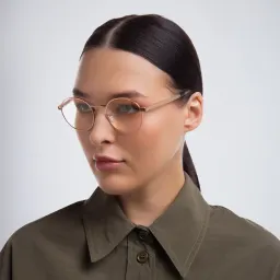 Shop PRADA Round Eyeglasses in Pink online.