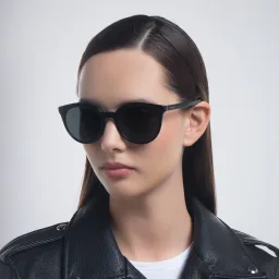 Shop PRADA Round Sunglasses in Black online.