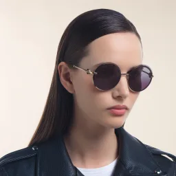 Shop BVLGARI Rimless Round Sunglasses in Pink Gold online.