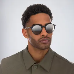Shop Ray-Ban Unisex Round Sunglasses in Black online.
