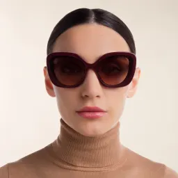 Shop MIU MIU Cat Eye Sunglasses in Pink Bordeaux online.