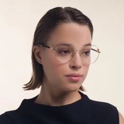 Shop Dolce & Gabbana Wide Round Eyeglasses in Gold online.