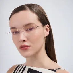 Shop Silhouette Rimless Rectangle Eyeglasses in Gold online.