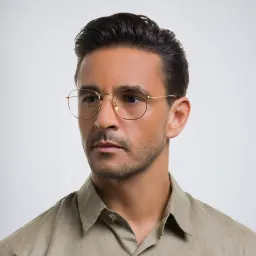 Shop Ray-Ban Hexagonal Unisex Eyeglasses in Polished Gold online.
