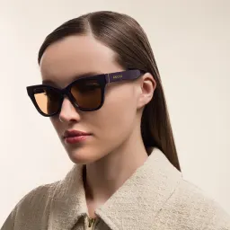 Shop GUCCI Cat Eye Sunglasses in Purple online.