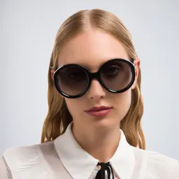 Shop GUCCI Oversized Round Sunglasses in Black online.