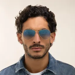 Shop Ray-Ban Unisex Pilot Sunglasses in Metal in Gold online.
