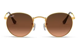 Shop Ray-Ban Round Metal Sunglasses in Gold online.