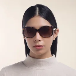 Shop PRADA Rectangle Sunglasses in Brown online.