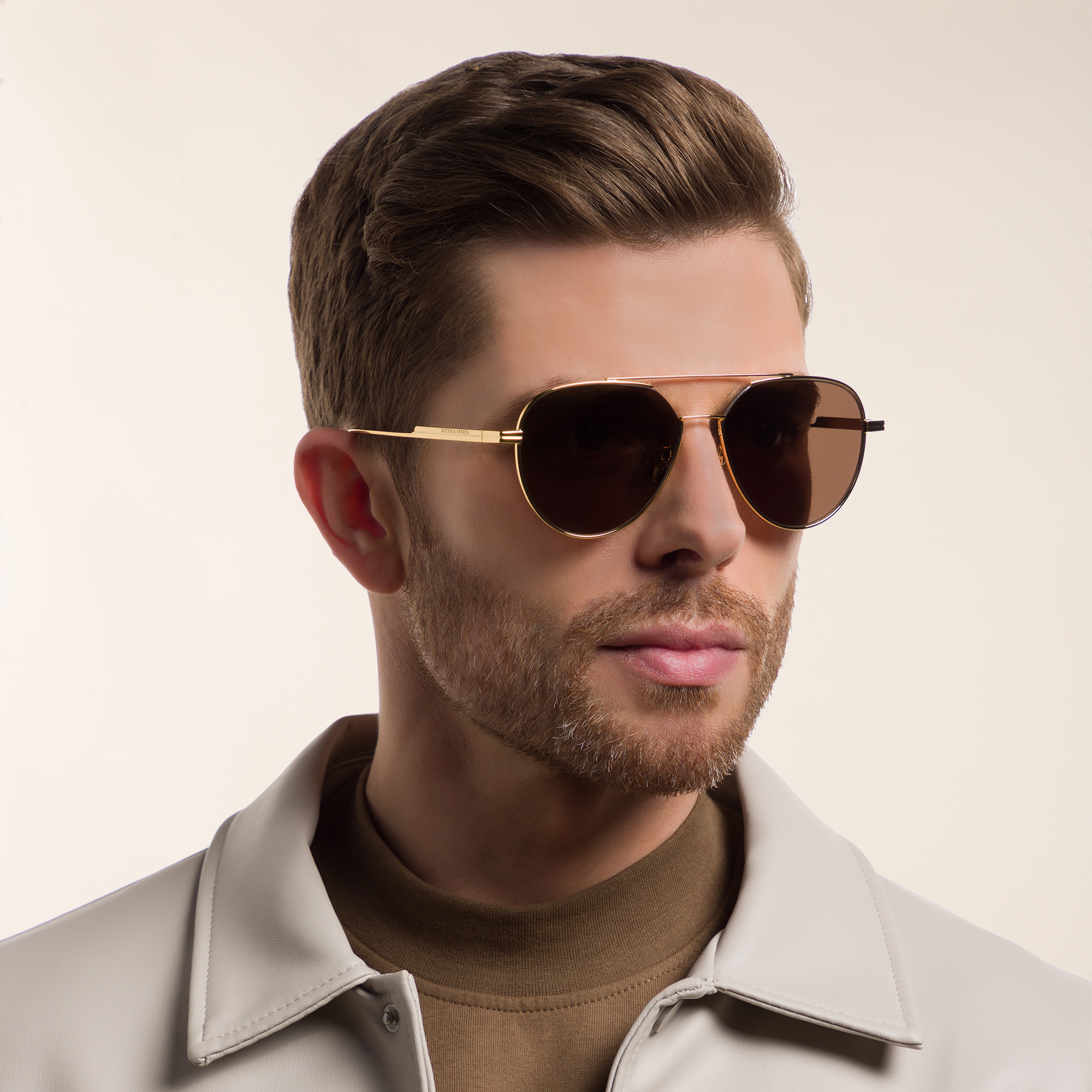 Shop BOTTEGA VENETA Unisex Aviator Sunglasses in Gold online.