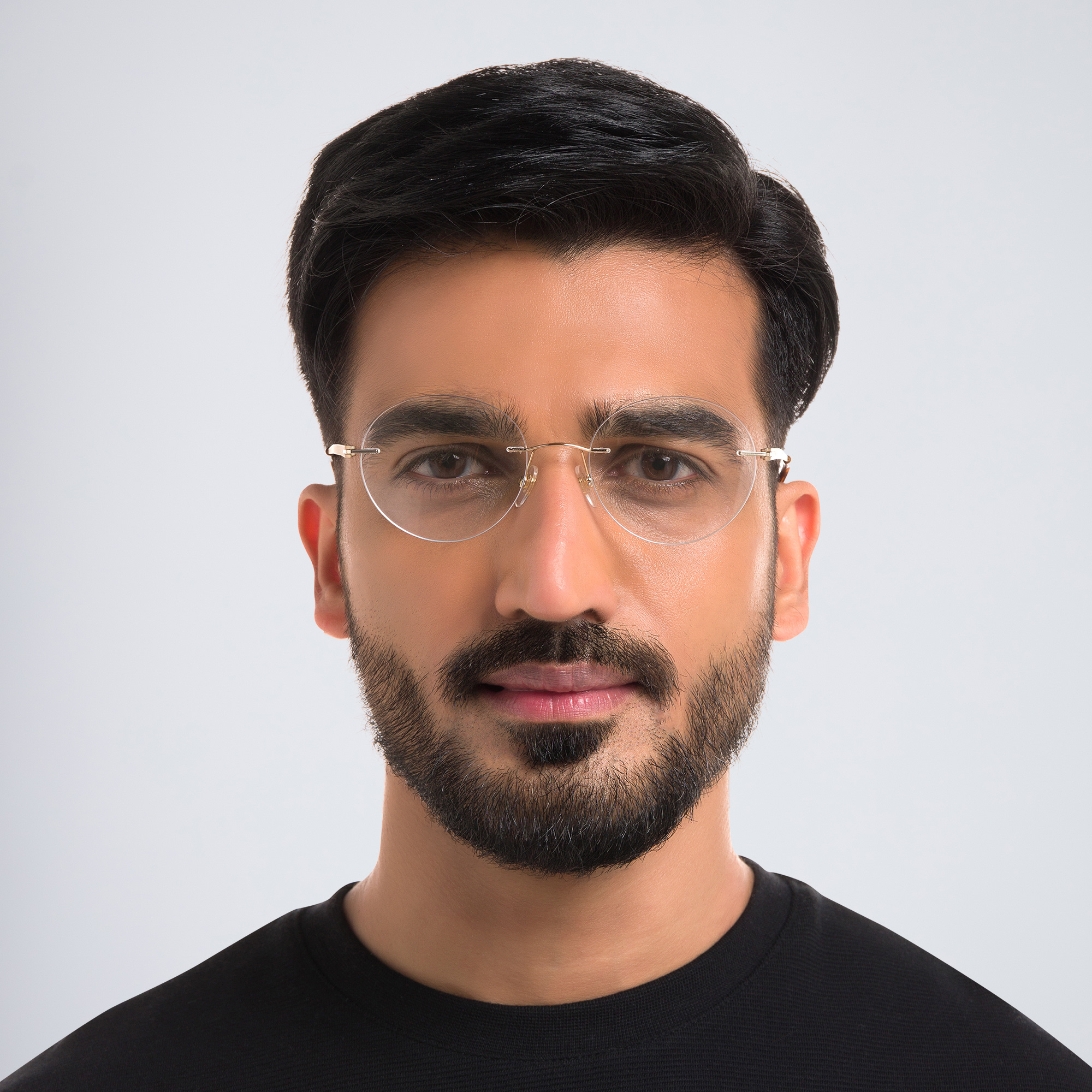 Shop EYE'M Rimless Round Eyeglasses in Gold online.