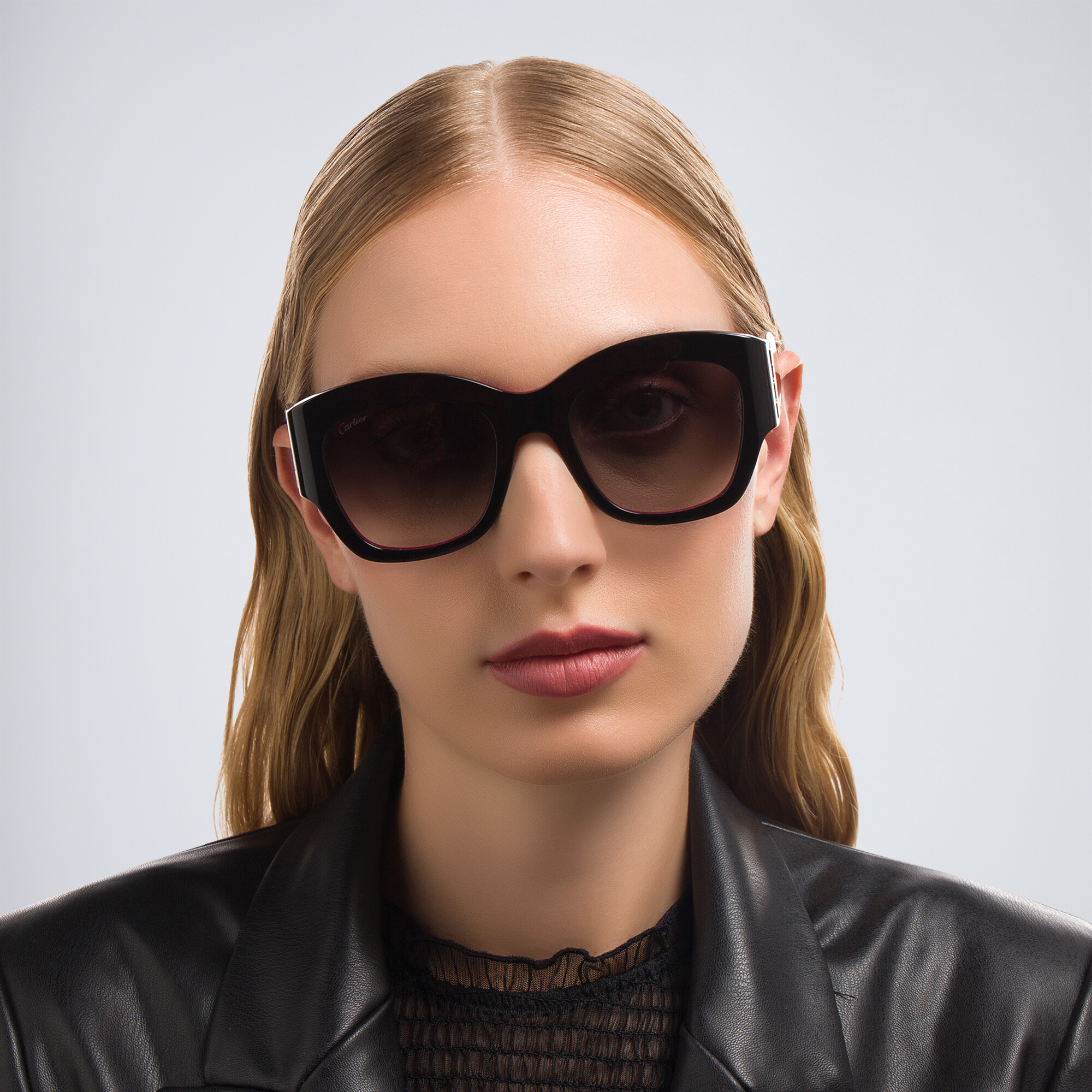 Shop Cartier Signature 'C'de Cartier Cat-Eye Sunglasses in Black On Pink online.