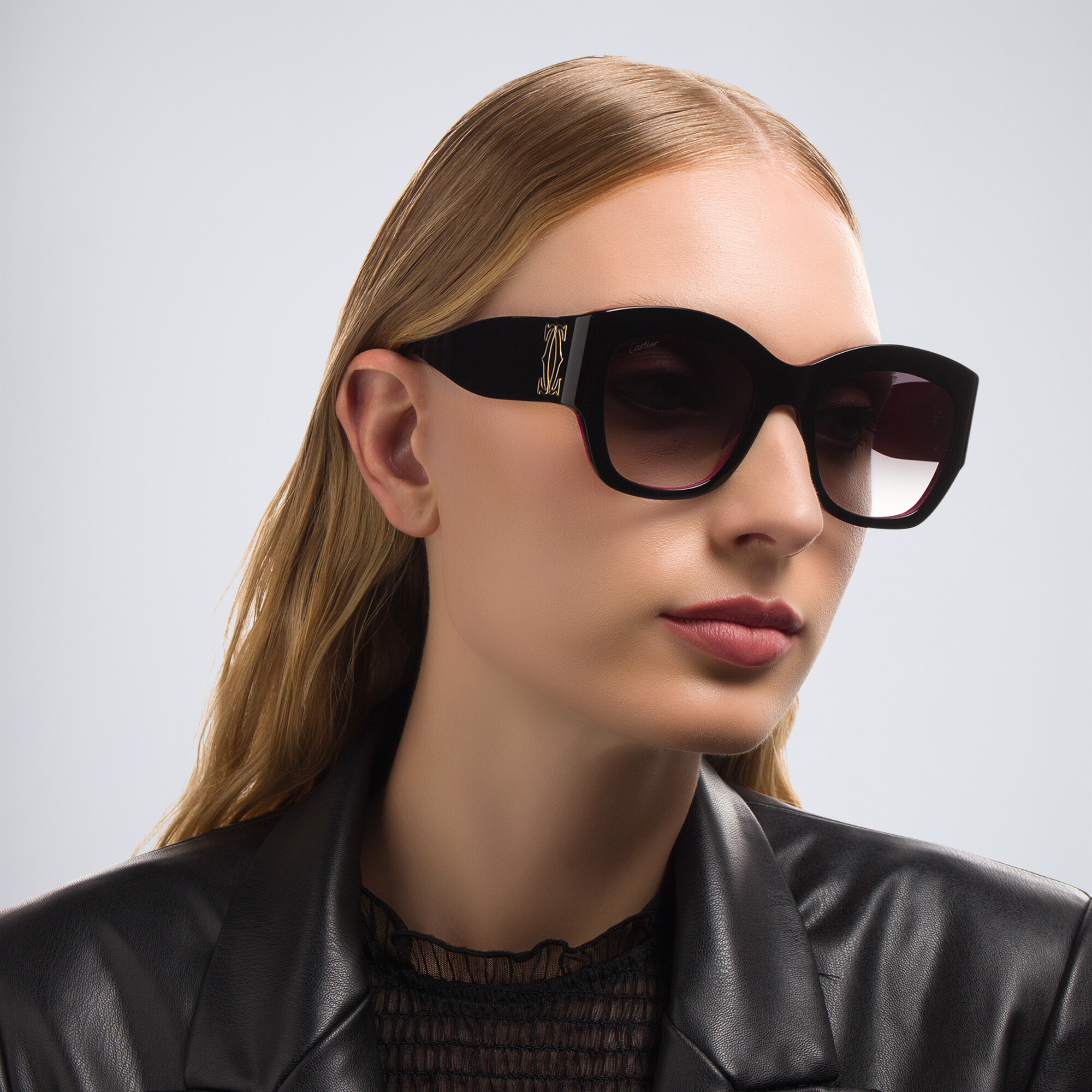 Shop Cartier Signature 'C'de Cartier Cat-Eye Sunglasses in Black On Pink online.