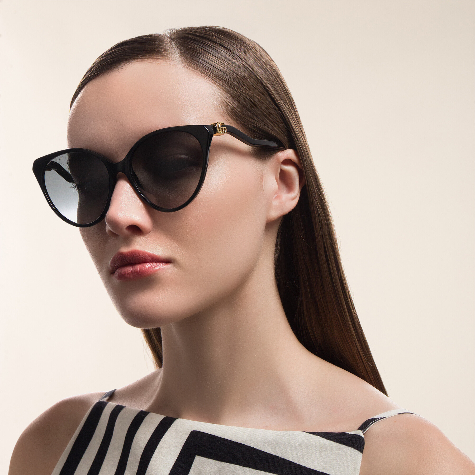 Shop GUCCI Cat Eye Sunglasses in Black online.
