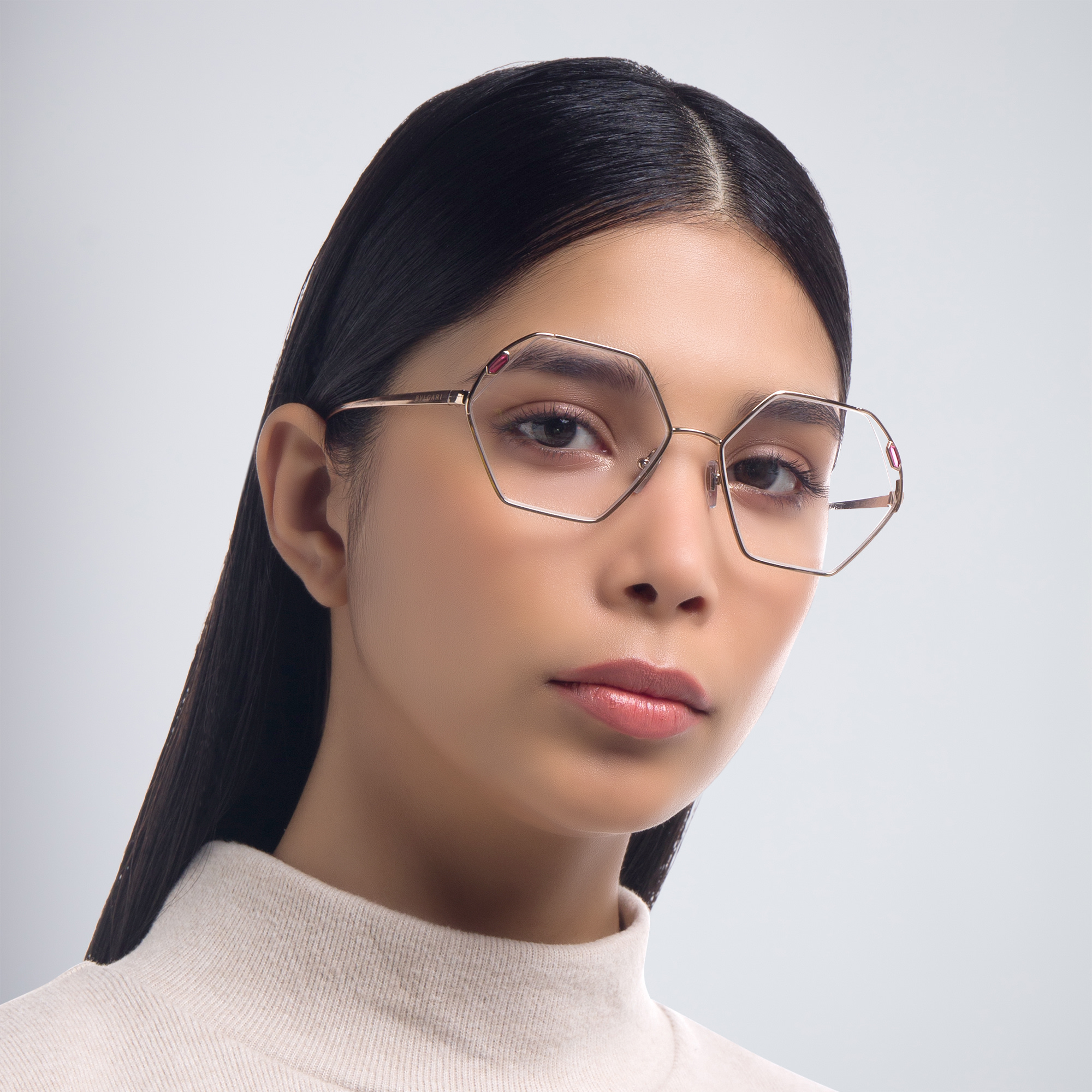 Shop BVLGARI Wide Irregular Eyeglasses in Pink Gold online.