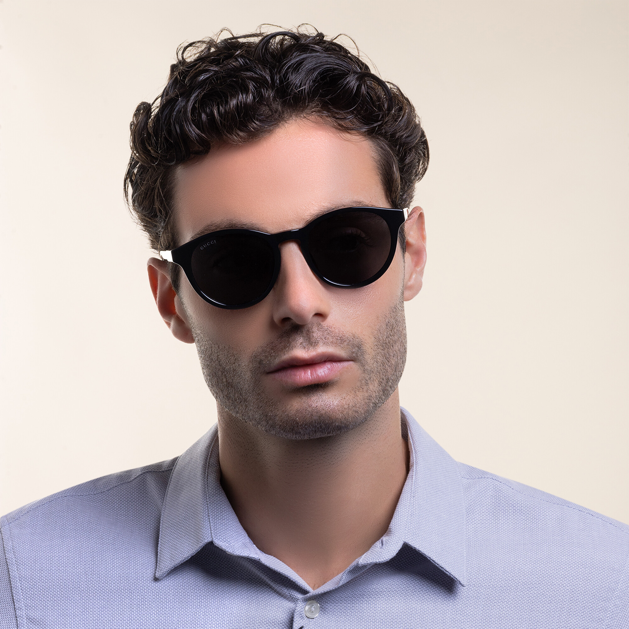 Shop GUCCI Round Sunglasses in Black online.