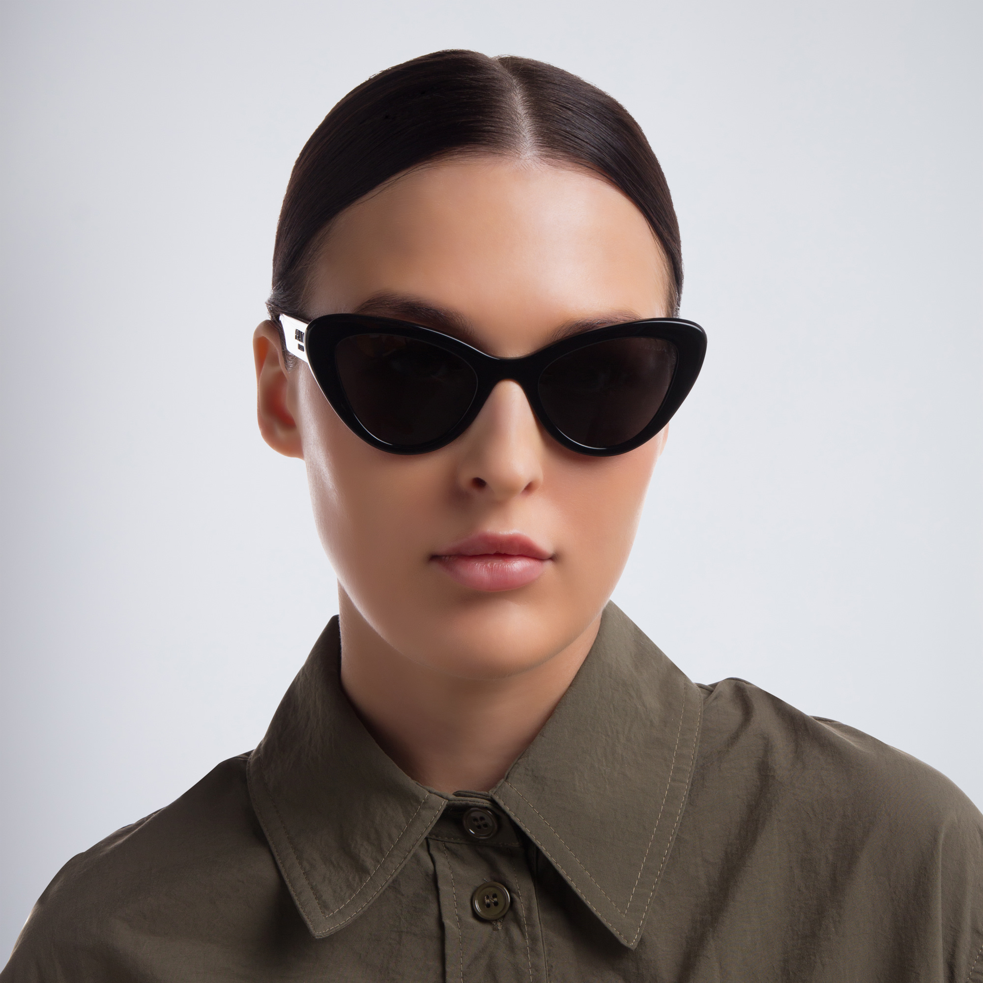 Shop PRADA Cat Eye Sunglasses in Black online.