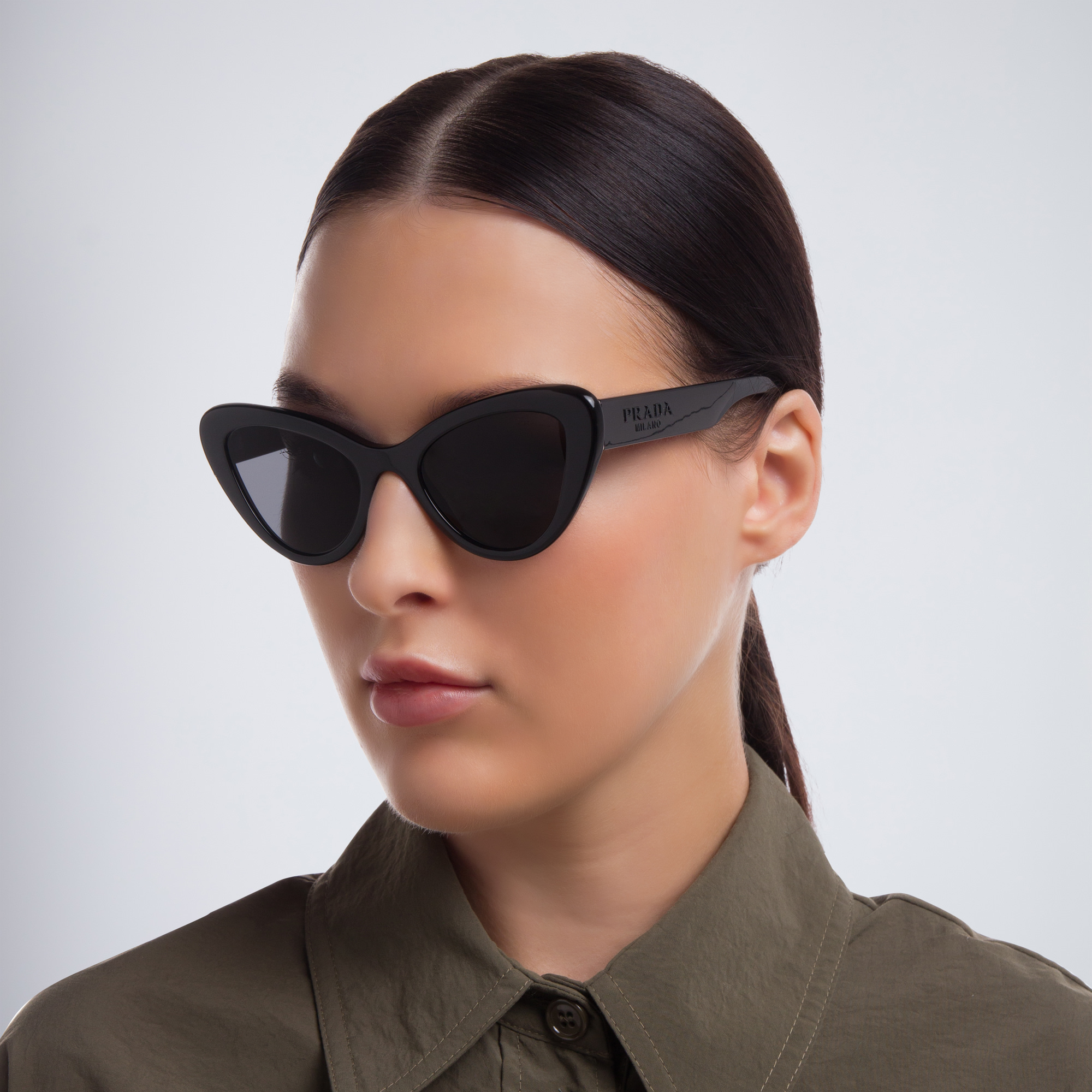 Shop PRADA Cat Eye Sunglasses in Black online.