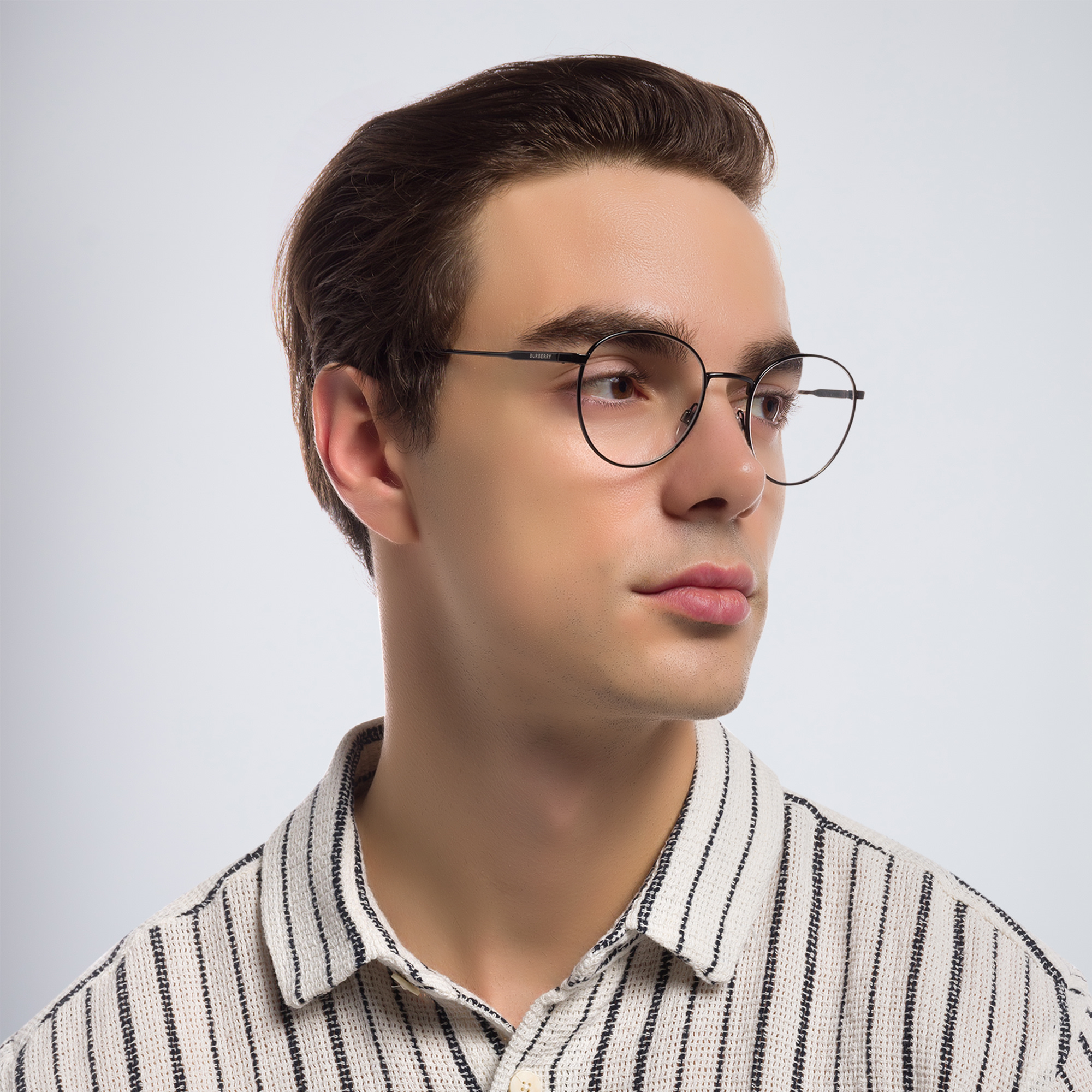 Shop BURBERRY Round Eyeglasses in Black online.