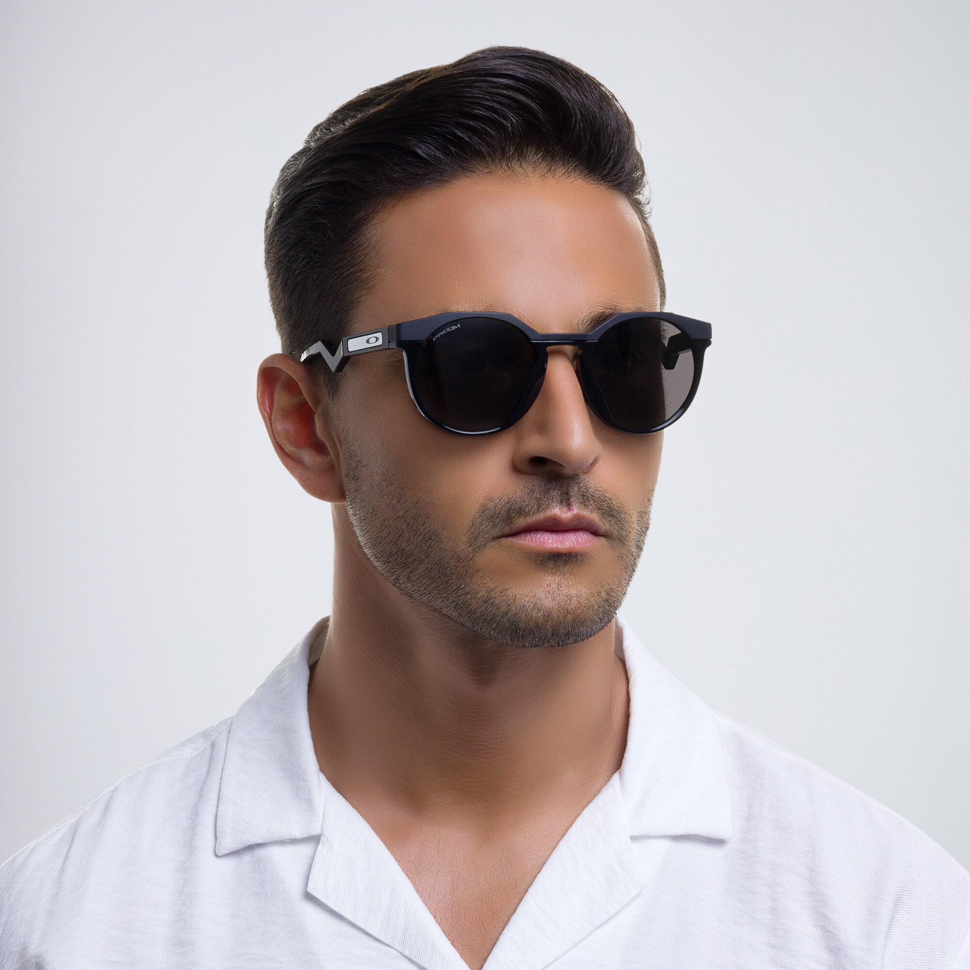 Shop Oakley HSTN Round Sunglasses in Matte Black online.