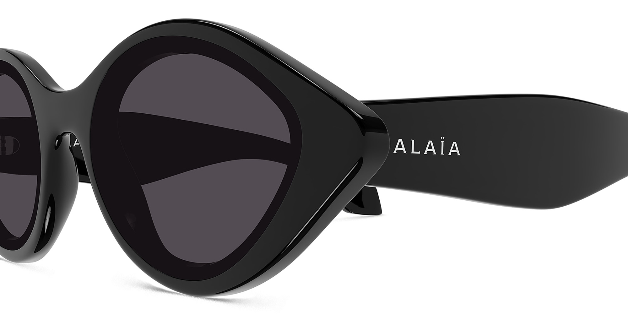 Shop ALAIA Logo Round Sunglasses in Black online.