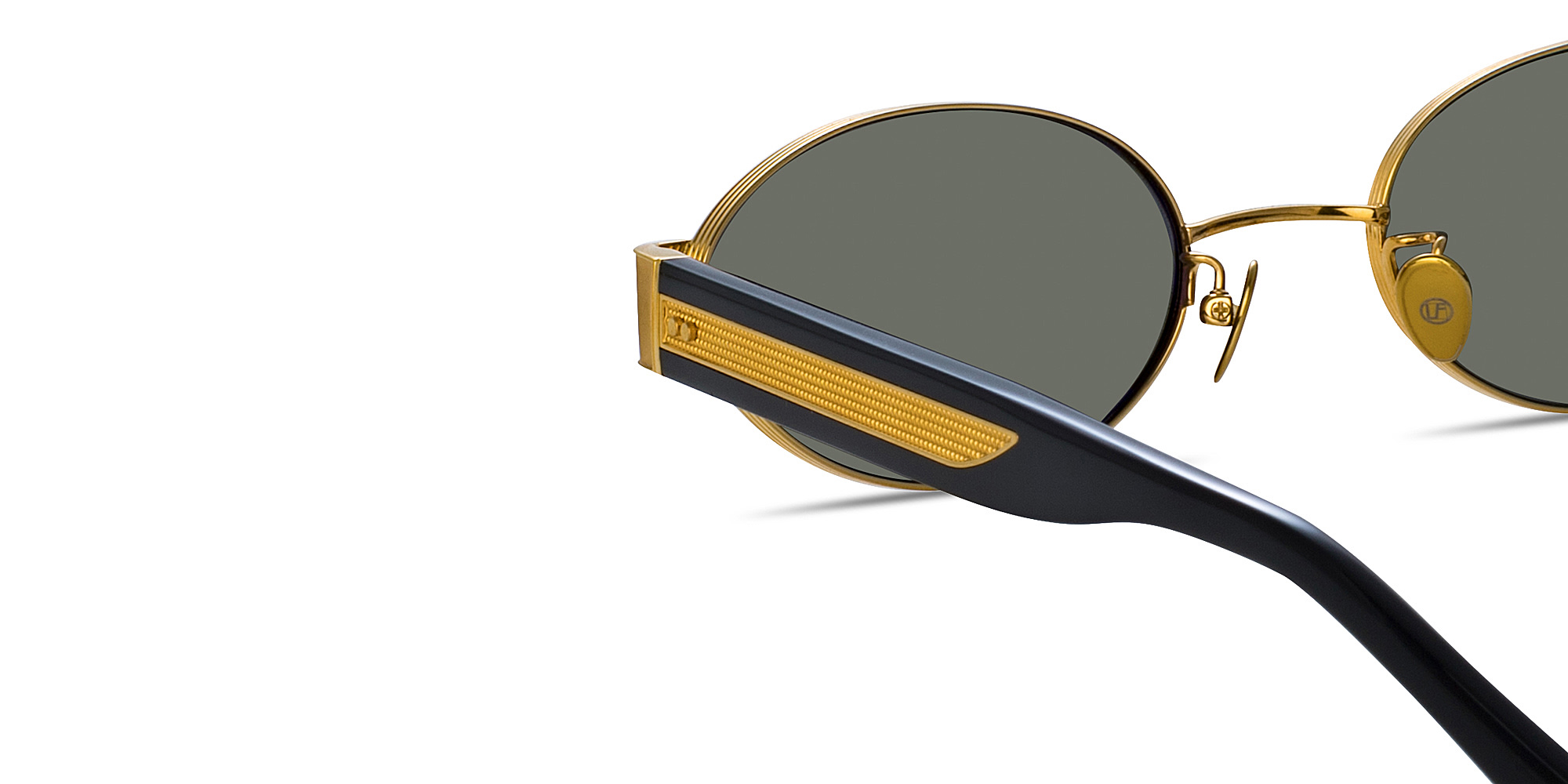 Shop LINDA FARROW Sadie Unisex Oval Sunglasses in Yellow Gold online.