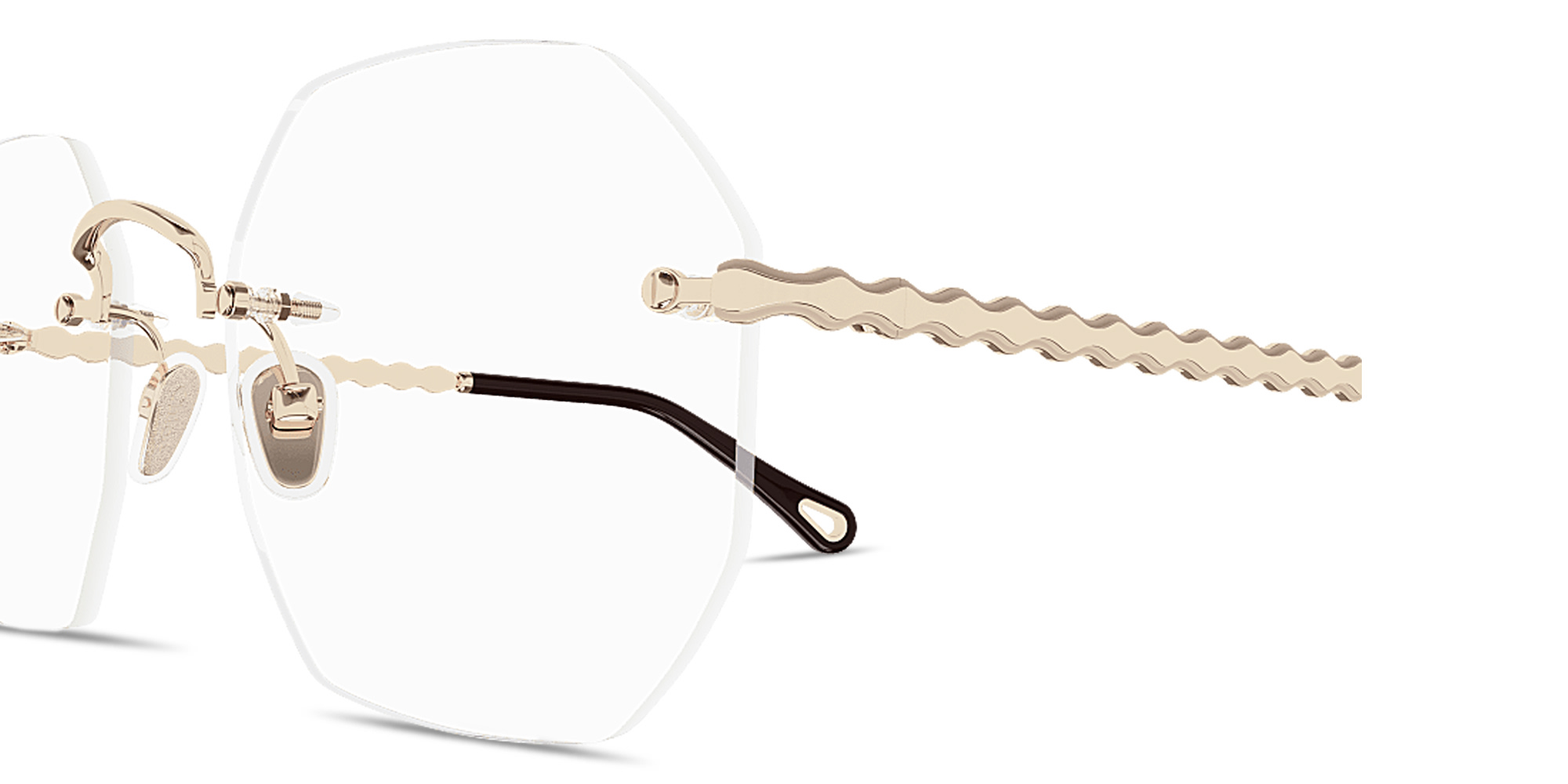 Shop Chloe Scalloped Rimless Irregular Eyeglasses in Gold online.