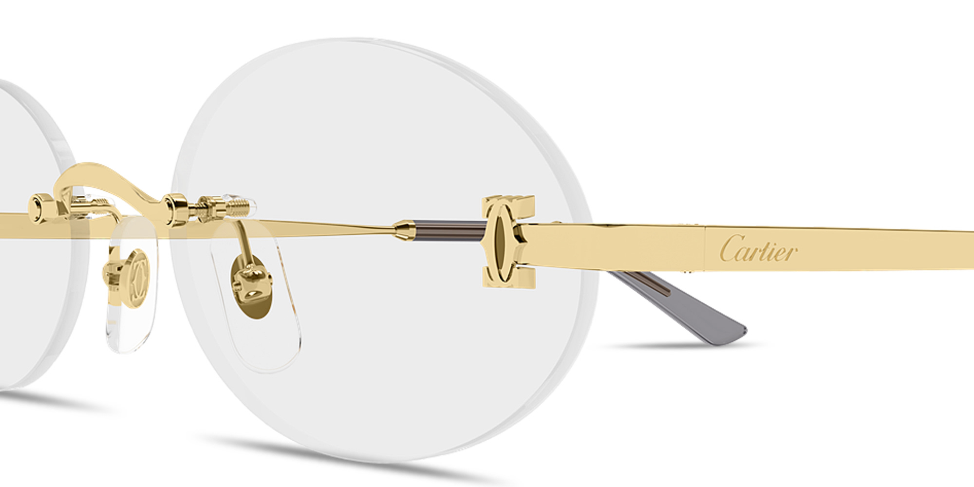 Shop Cartier Double C de Cartier Rimless Oval Eyeglasses in Gold online.