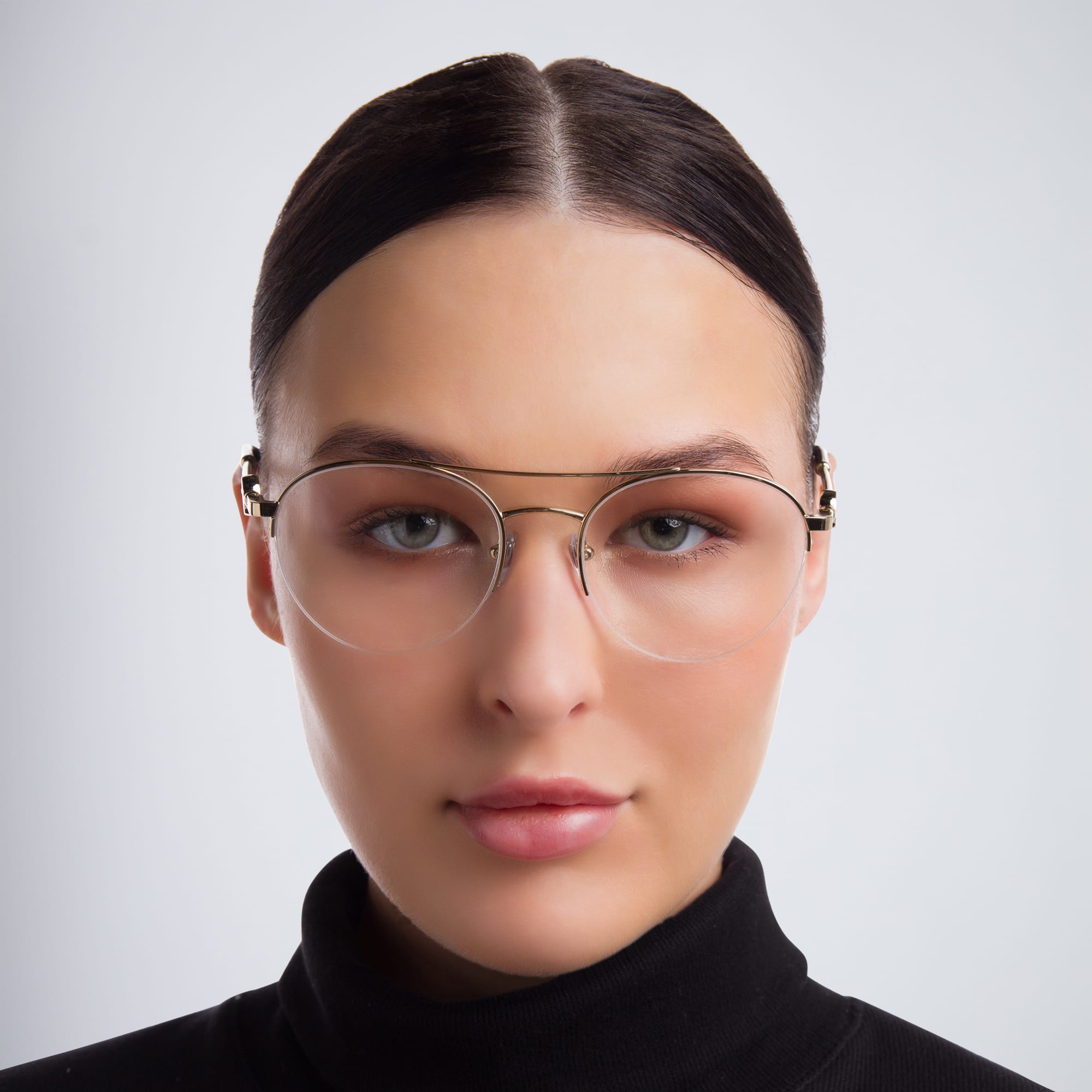 Shop BVLGARI Half Rim Round Eyeglasses in Pale Gold online.